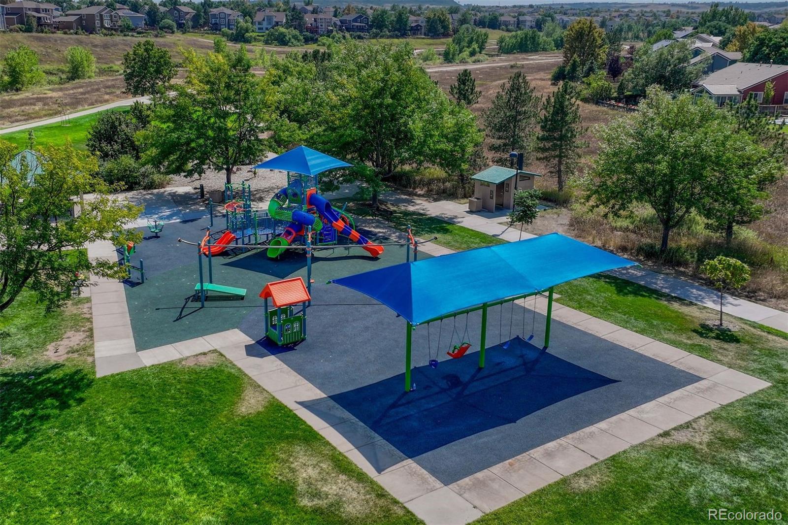 4927 Tarcoola Lane Highlands Ranch, CO 80130 - Photo 30 of 30 a view of a chairs and table in the garden