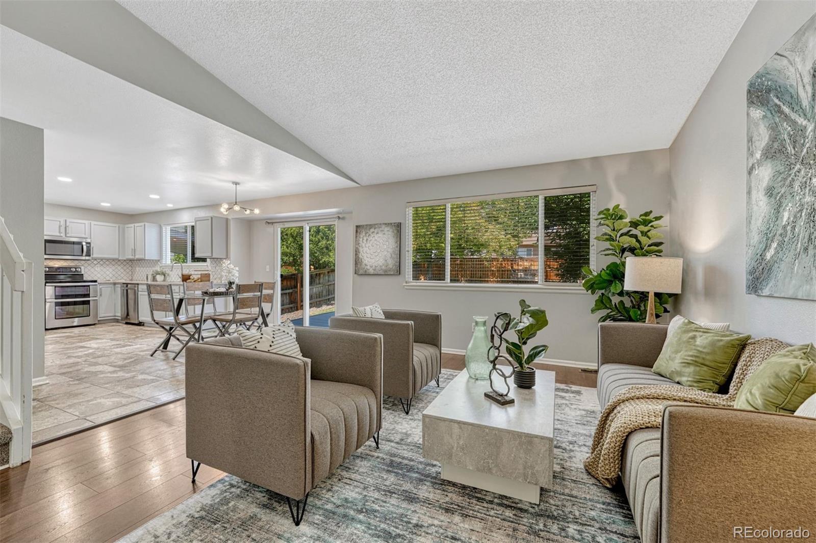 4927 Tarcoola Lane Highlands Ranch, CO 80130 - Photo 5 of 30 a living room with furniture and a large window