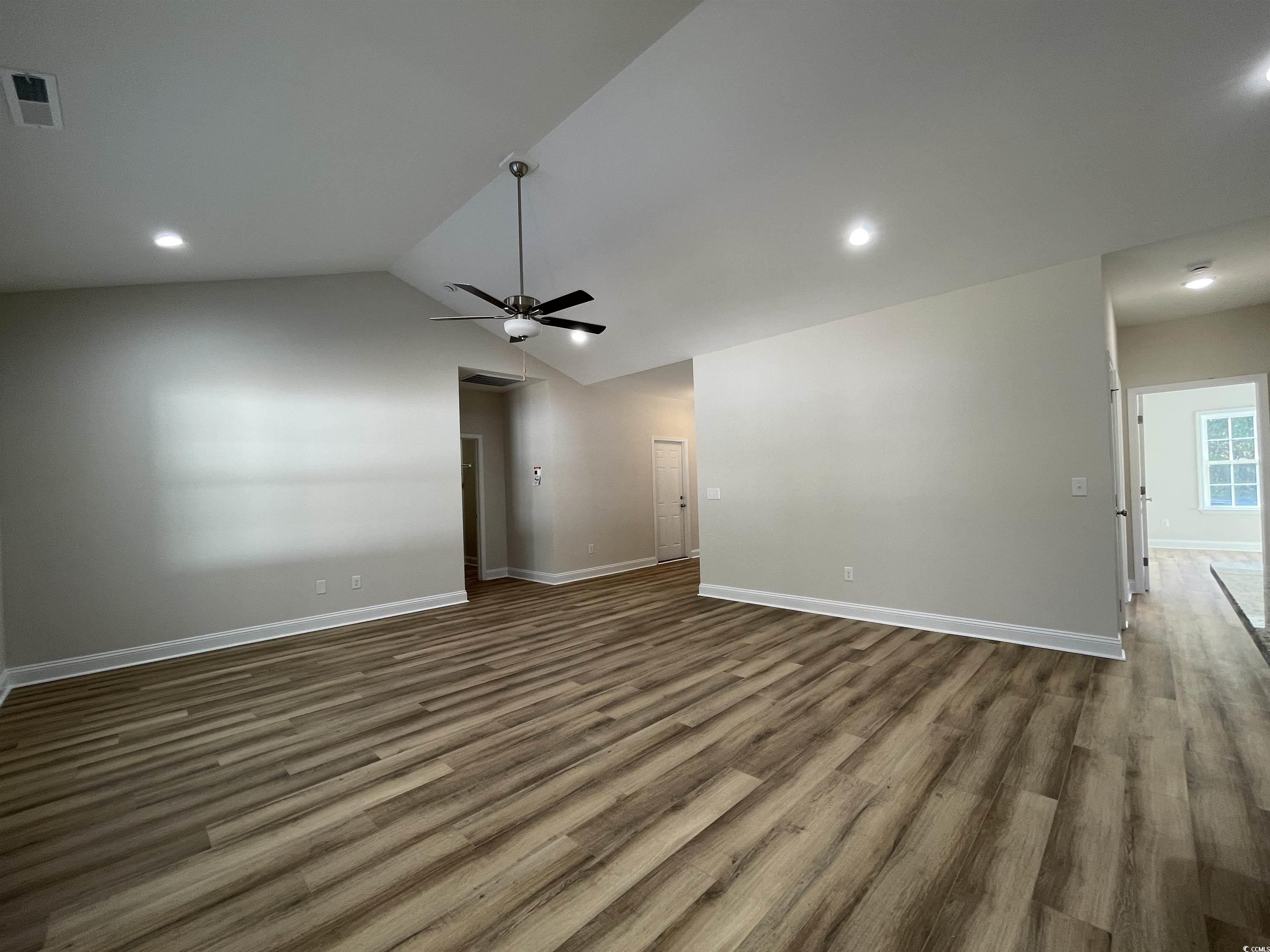 6017 Flossie Road Conway, SC 29527 - Photo 3 of 20 Unfurnished living room with ceiling fan, dark woo