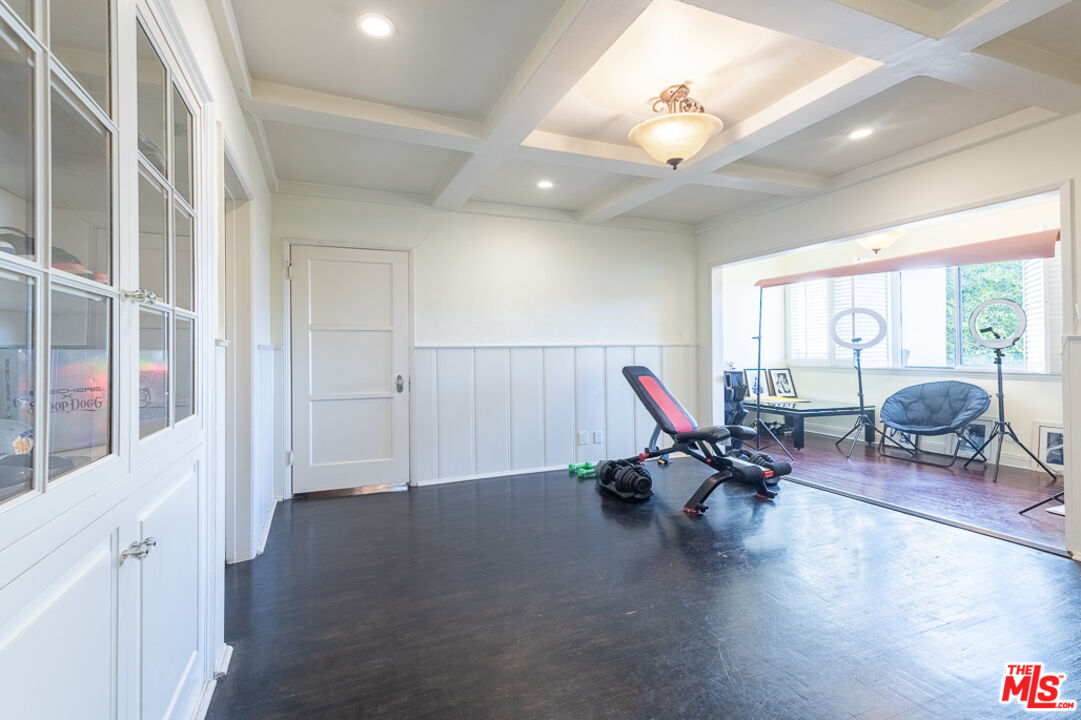 340 South Reeves Drive Beverly Hills, CA 90212 - Photo 13 of 35 a living room with furniture and white walls