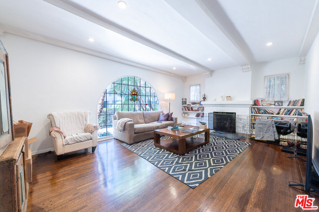 340 South Reeves Drive Beverly Hills, CA 90212 - Photo 18 of 35 a living room with furniture fireplace and a wooden floor