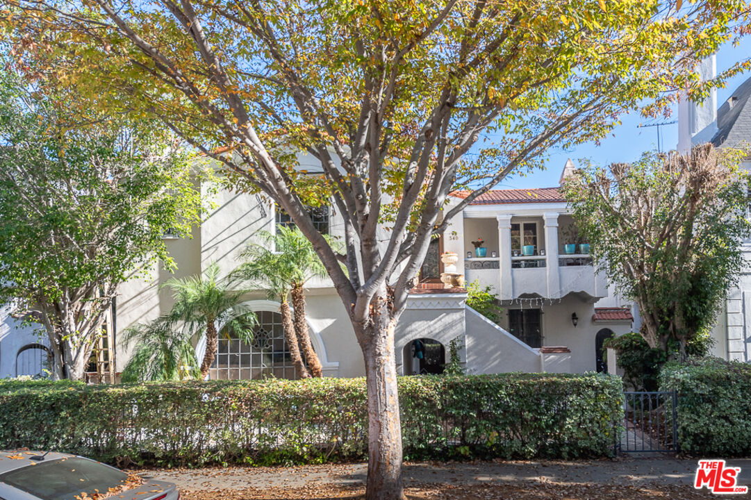 340 South Reeves Drive Beverly Hills, CA 90212 - Photo 2 of 35 a front view of a house with a tree