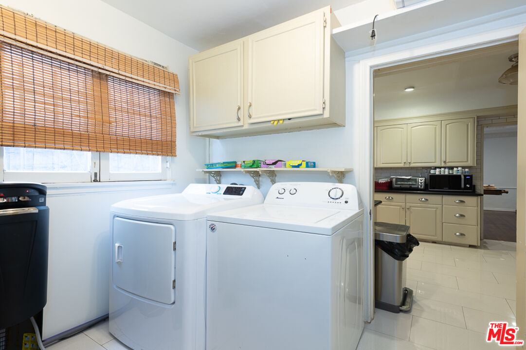 340 South Reeves Drive Beverly Hills, CA 90212 - Photo 23 of 35 a utility room with dryer and washer