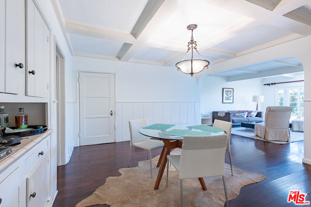 340 South Reeves Drive Beverly Hills, CA 90212 - Photo 25 of 35 a view of a dining room with furniture window and wooden floor