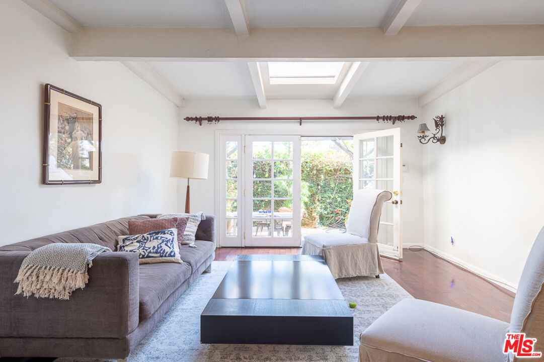 340 South Reeves Drive Beverly Hills, CA 90212 - Photo 27 of 35 a living room with furniture and a large window