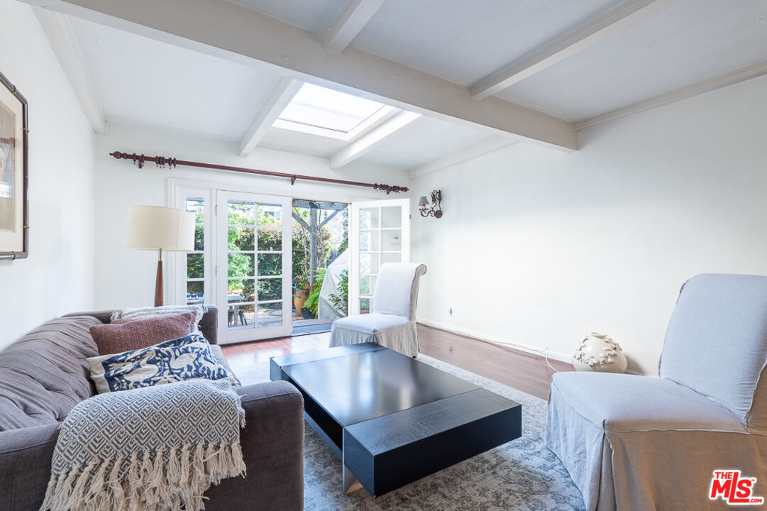 340 South Reeves Drive Beverly Hills, CA 90212 - Photo 28 of 35 a living room with furniture and a large window