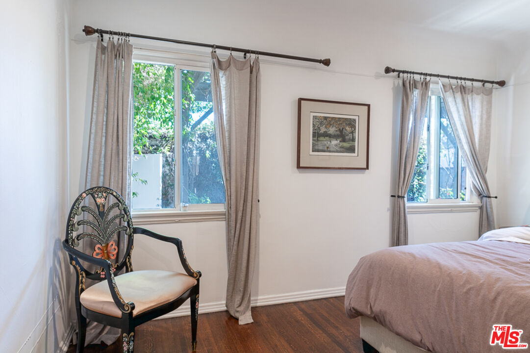 340 South Reeves Drive Beverly Hills, CA 90212 - Photo 29 of 35 a bedroom with a bed and a window