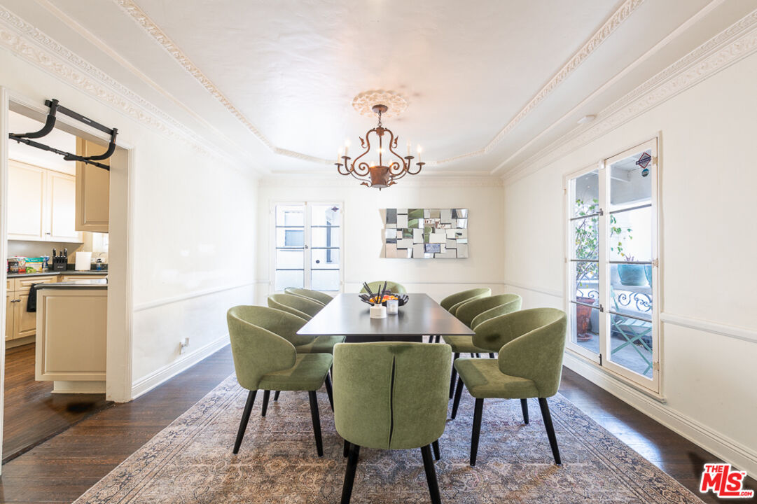 340 South Reeves Drive Beverly Hills, CA 90212 - Photo 7 of 35 a living room with furniture and a chandelier
