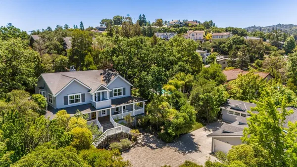 an aerial view of a house with a garden