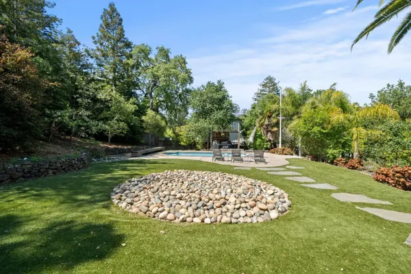 a view of outdoor space with deck and tree