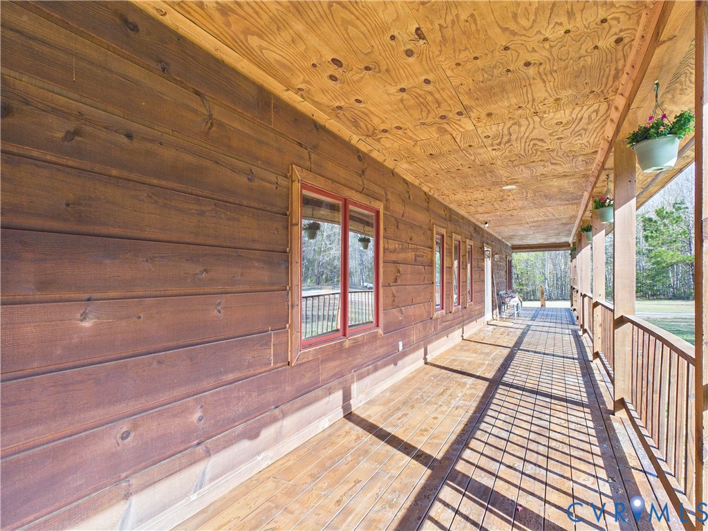 469 Jenkins Church Road Cumberland, VA 23040 - Photo 24 of 40 a view of balcony with wooden floor and outdoor space