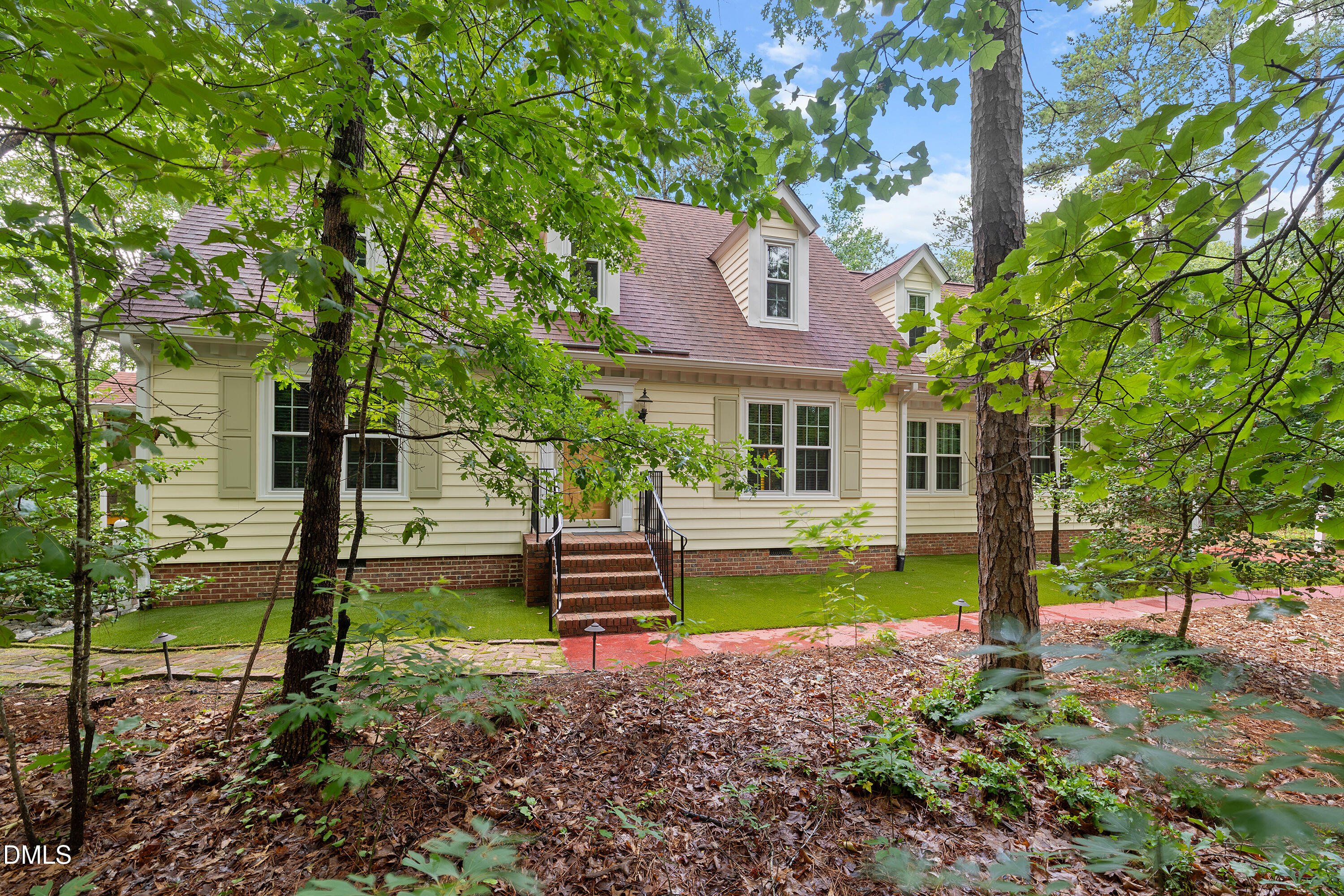 5216 Bridget Drive Raleigh, NC 27603 - Photo 2 of 30 a front view of a house with garden