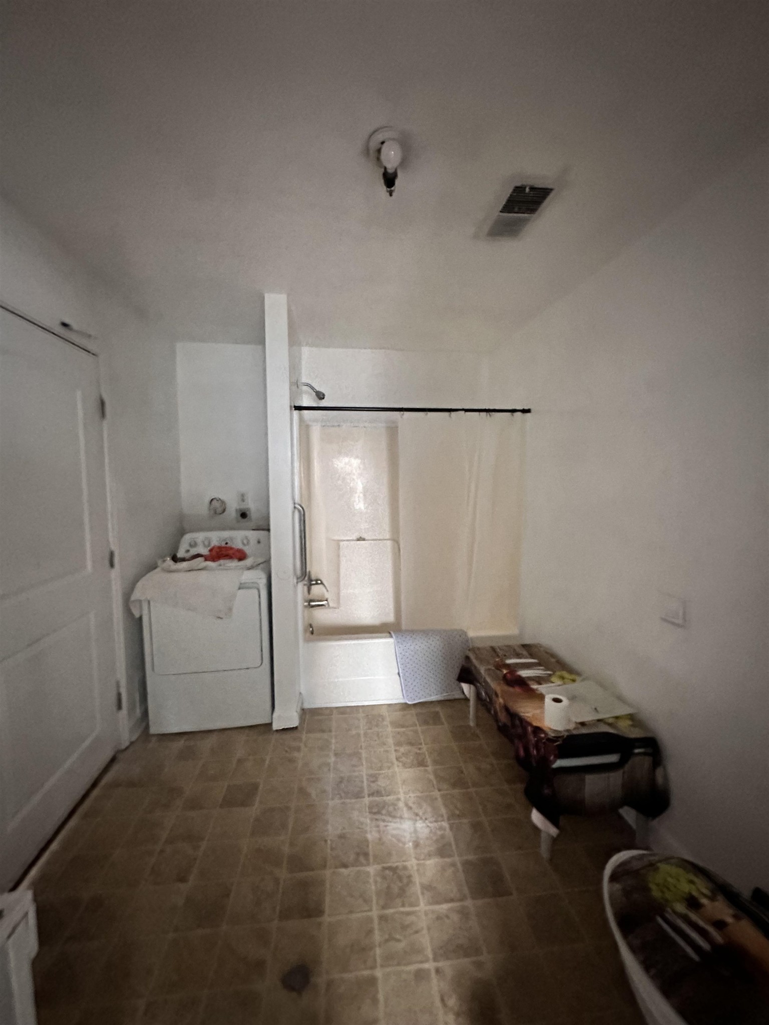 123 Lucy Avenue Memphis, TN 38106 - Photo 13 of 25 a room with a couch and a stove top oven