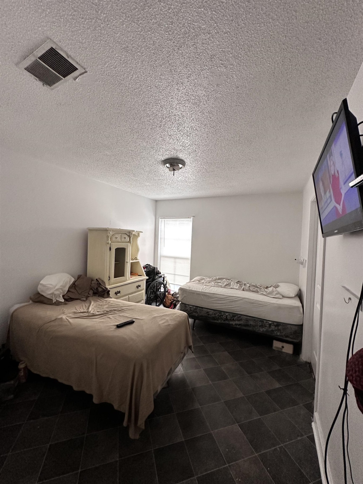 123 Lucy Avenue Memphis, TN 38106 - Photo 15 of 25 a bed room with a bed and a chair