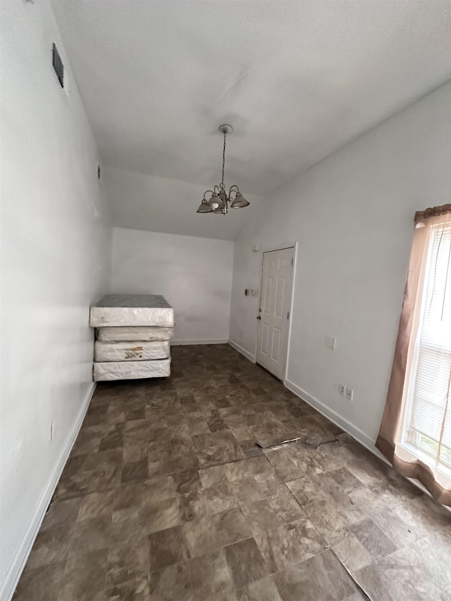 123 Lucy Avenue Memphis, TN 38106 - Photo 5 of 25 a view of room with stairs and a chandelier fan