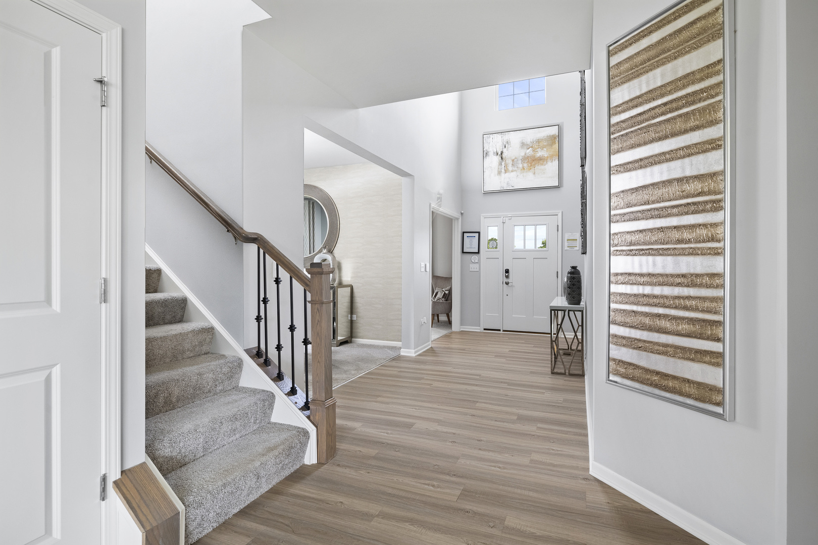 3661 Edelweiss Road Elgin, IL 60124 - Photo 4 of 29 a view of a hallway with wooden floor and windows
