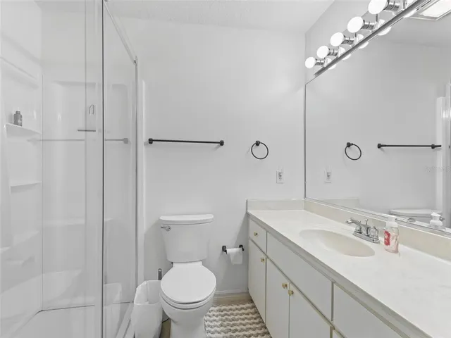 a view of backyard with large trees