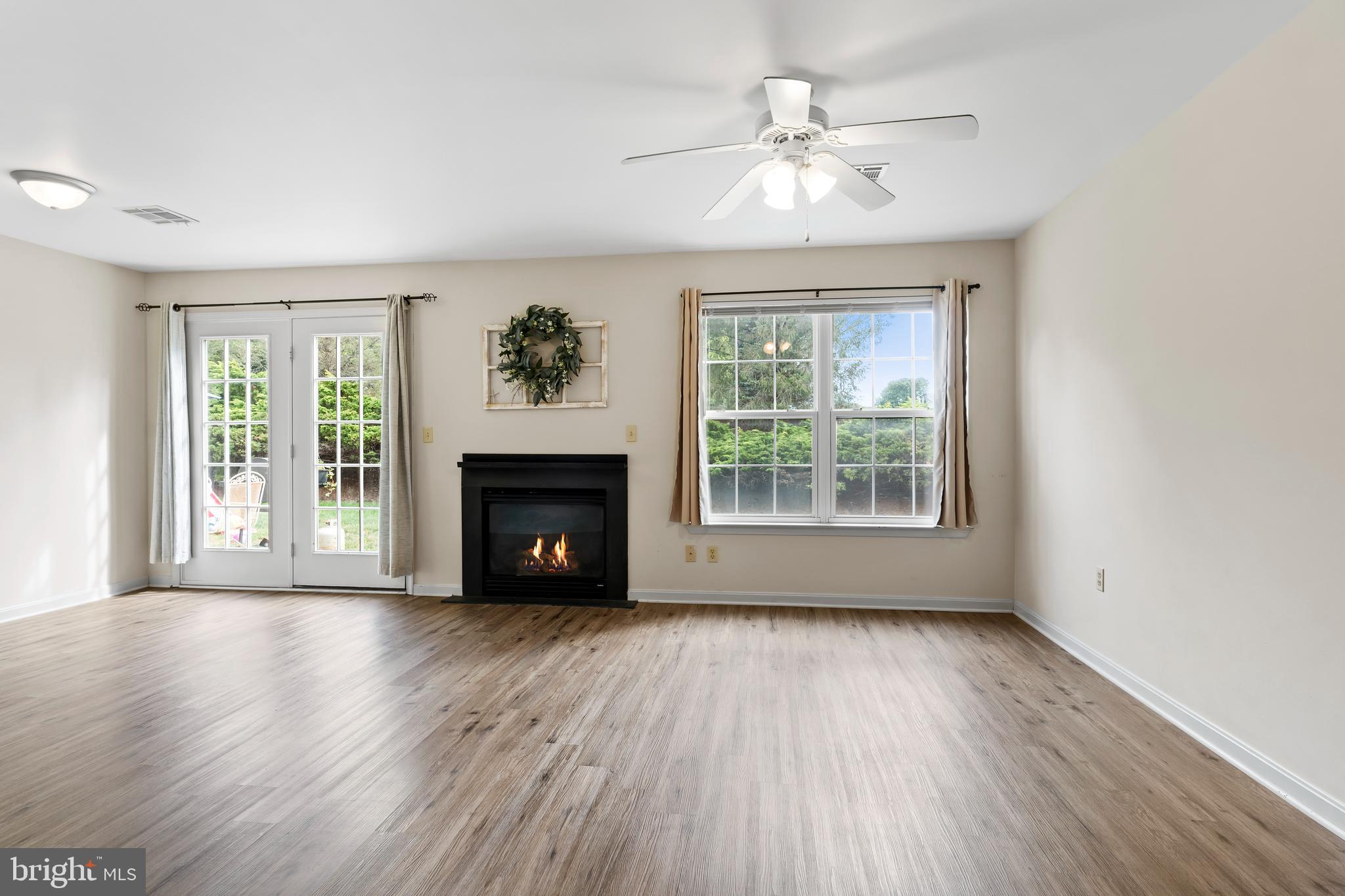 149 Cardinal Lane Hummelstown, PA 17036 - Photo 8 of 28 a view of an empty room with wooden floor and a window