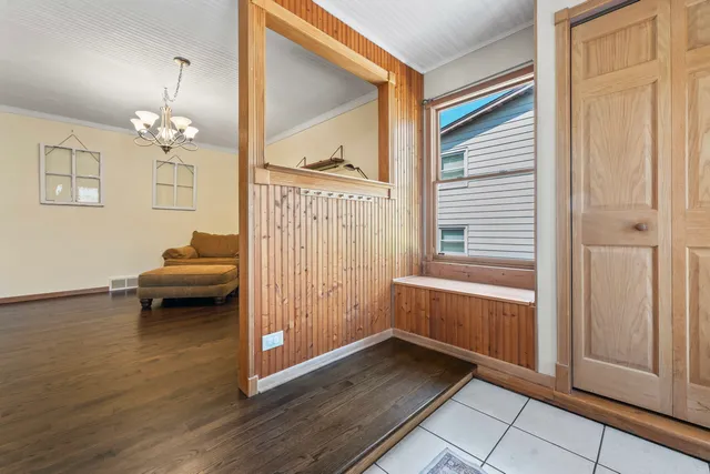 a view of a livingroom with furniture and hardwood floor