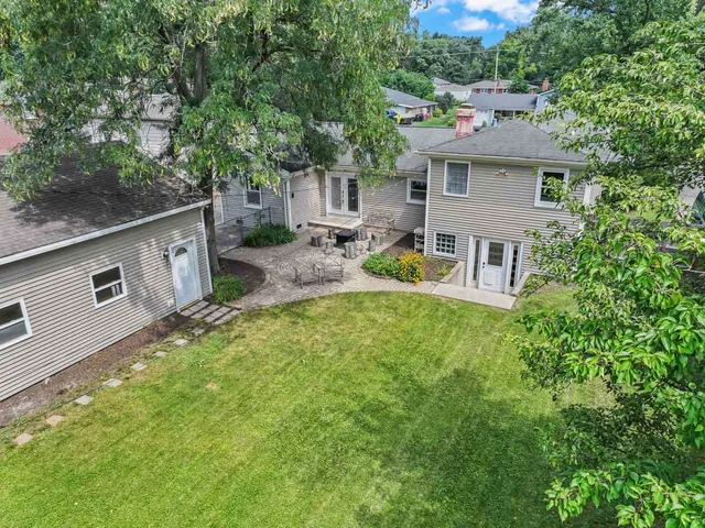 a view of a house with a yard porch and sitting area