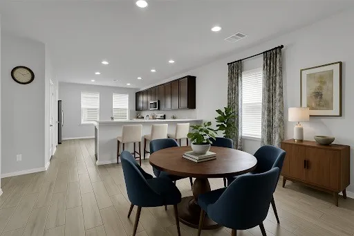 a dining room with furniture and window