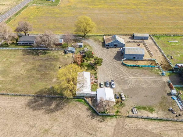 an aerial view of a house with a ocean view