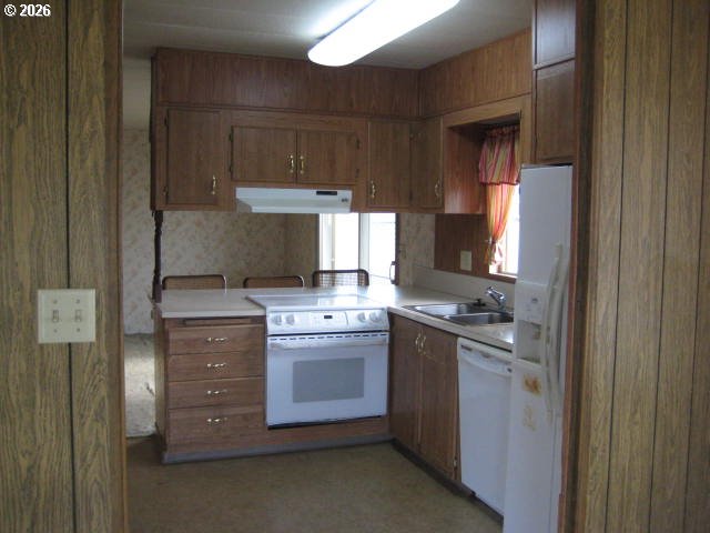 5355 River Road North, Unit 98 Keizer, OR 97303 - Photo 18 of 34 a kitchen with stainless steel appliances granite countertop a stove a refrigerator and a stove