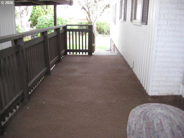5355 River Road North, Unit 98 Keizer, OR 97303 - Photo 6 of 34 a view of a balcony with wooden fence