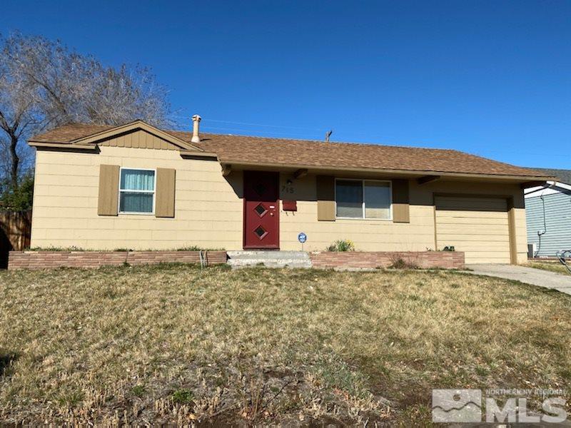 715 Reeves Avenue Reno, NV 89503 - Photo 1 of 7 a front view of a house with a yard