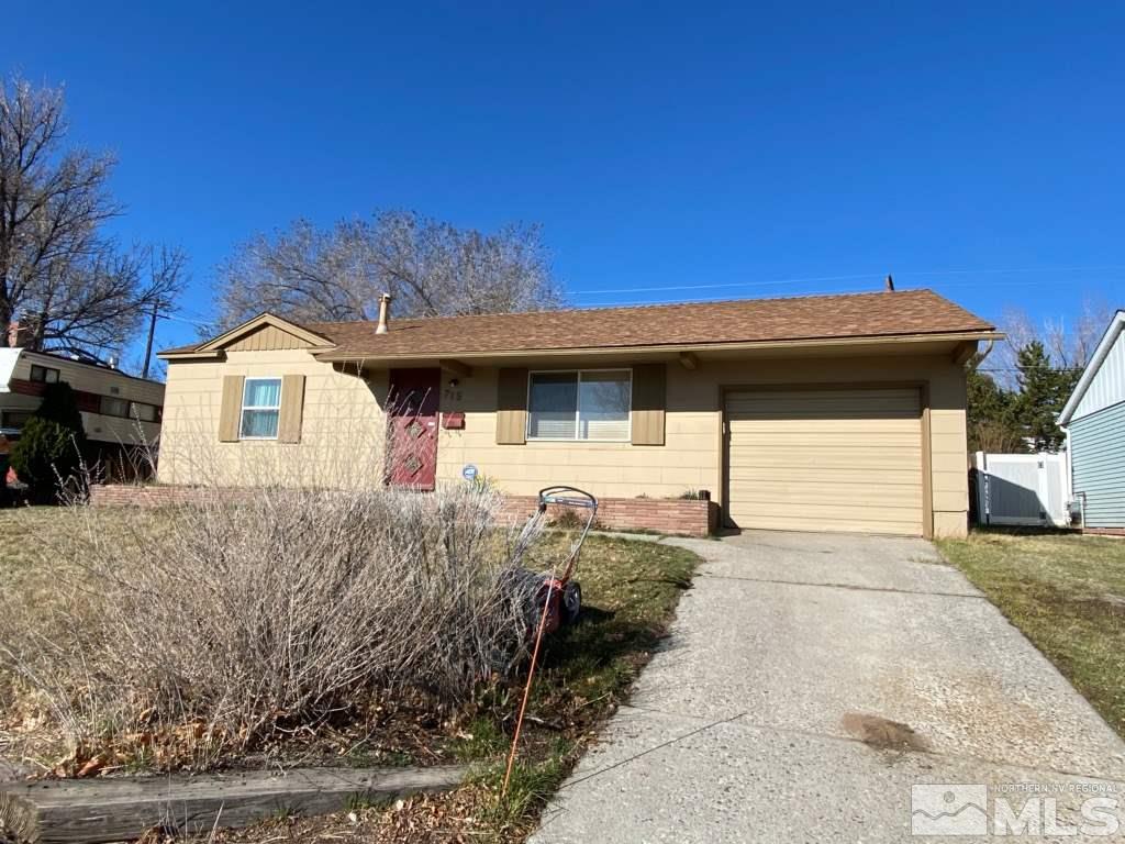 715 Reeves Avenue Reno, NV 89503 - Photo 2 of 7 a front view of a house with garage