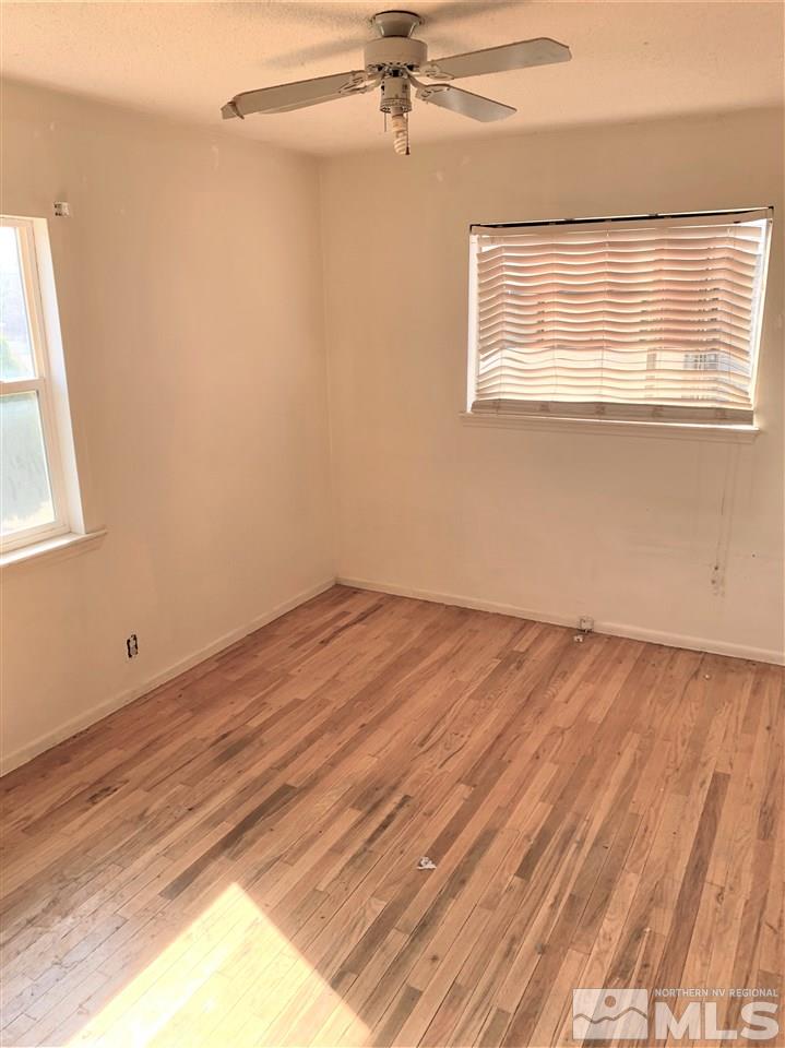 715 Reeves Avenue Reno, NV 89503 - Photo 4 of 7 a view of a room with wooden floor and a window