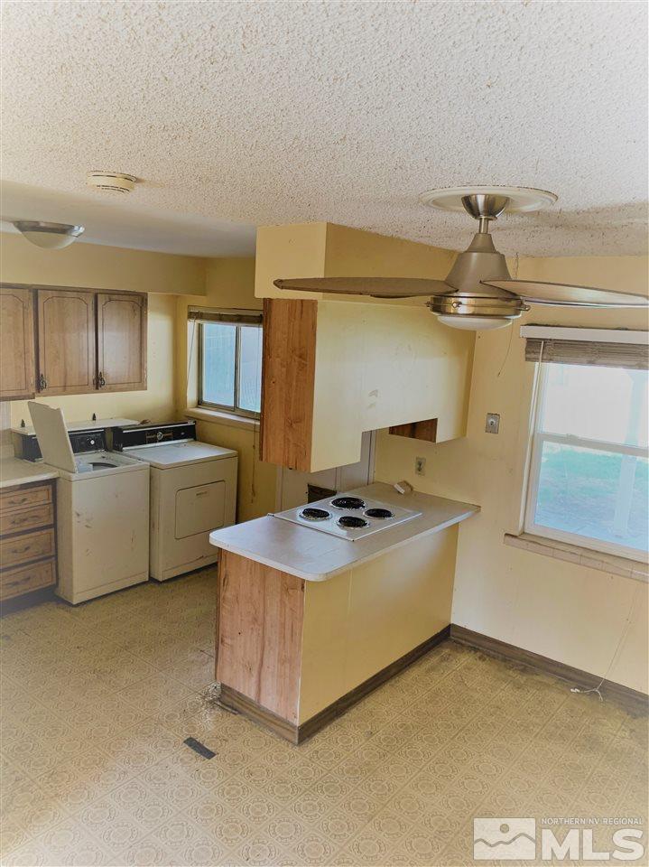 715 Reeves Avenue Reno, NV 89503 - Photo 5 of 7 a kitchen with stainless steel appliances a sink a stove and cabinets