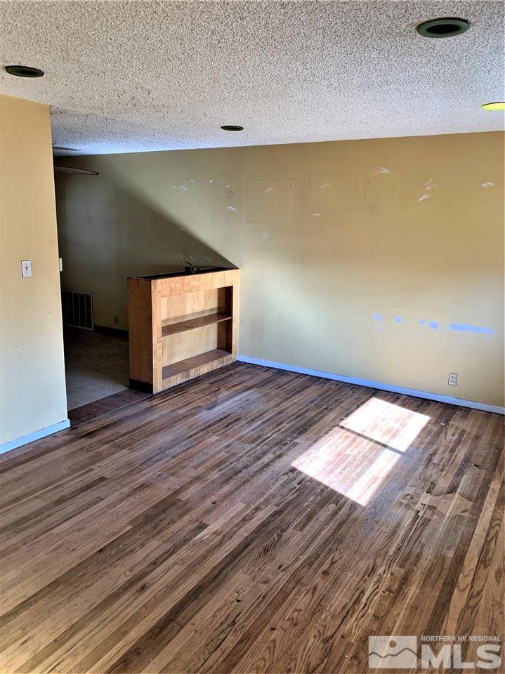 715 Reeves Avenue Reno, NV 89503 - Photo 7 of 7 a view of empty room with wooden floor