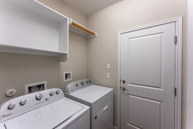 a kitchen with a sink stove and refrigerator