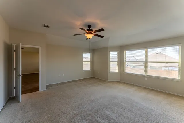 a view of an empty room with a window