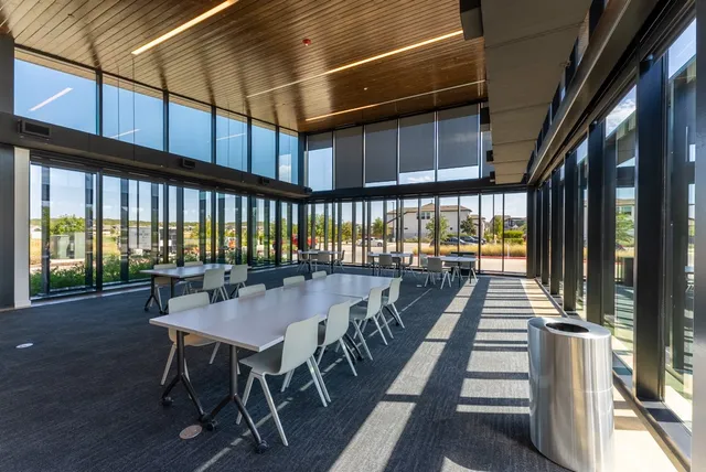 a view of a patio with table and chairs