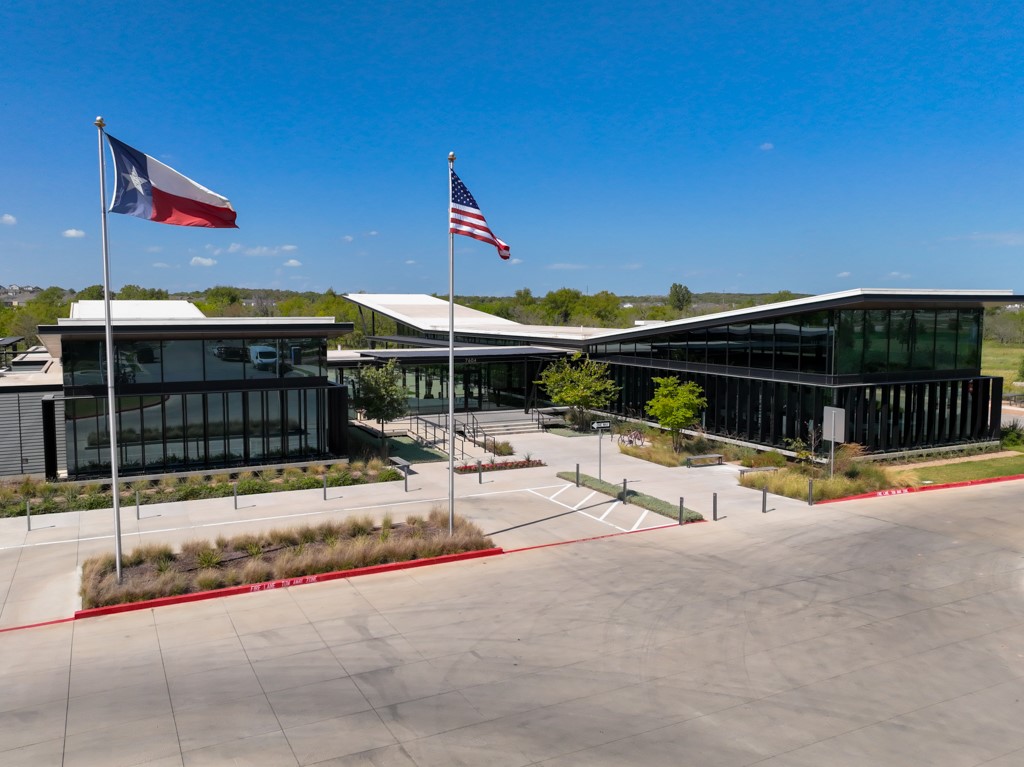 7304 Van Ness Street Austin, TX 78744 - Photo 36 of 37 a view of a patio with a table and chairs under an umbrella