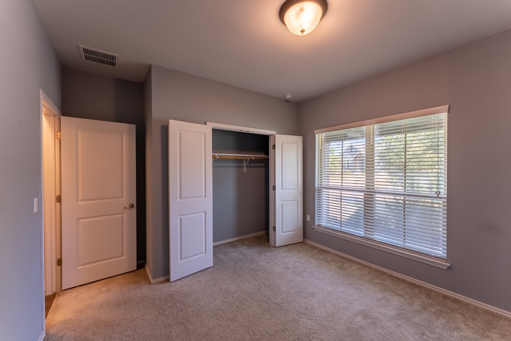 7304 Van Ness Street Austin, TX 78744 - Photo 6 of 37 a view of an empty room with a window