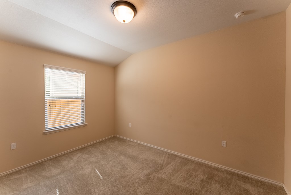 7304 Van Ness Street Austin, TX 78744 - Photo 9 of 37 an empty room with windows