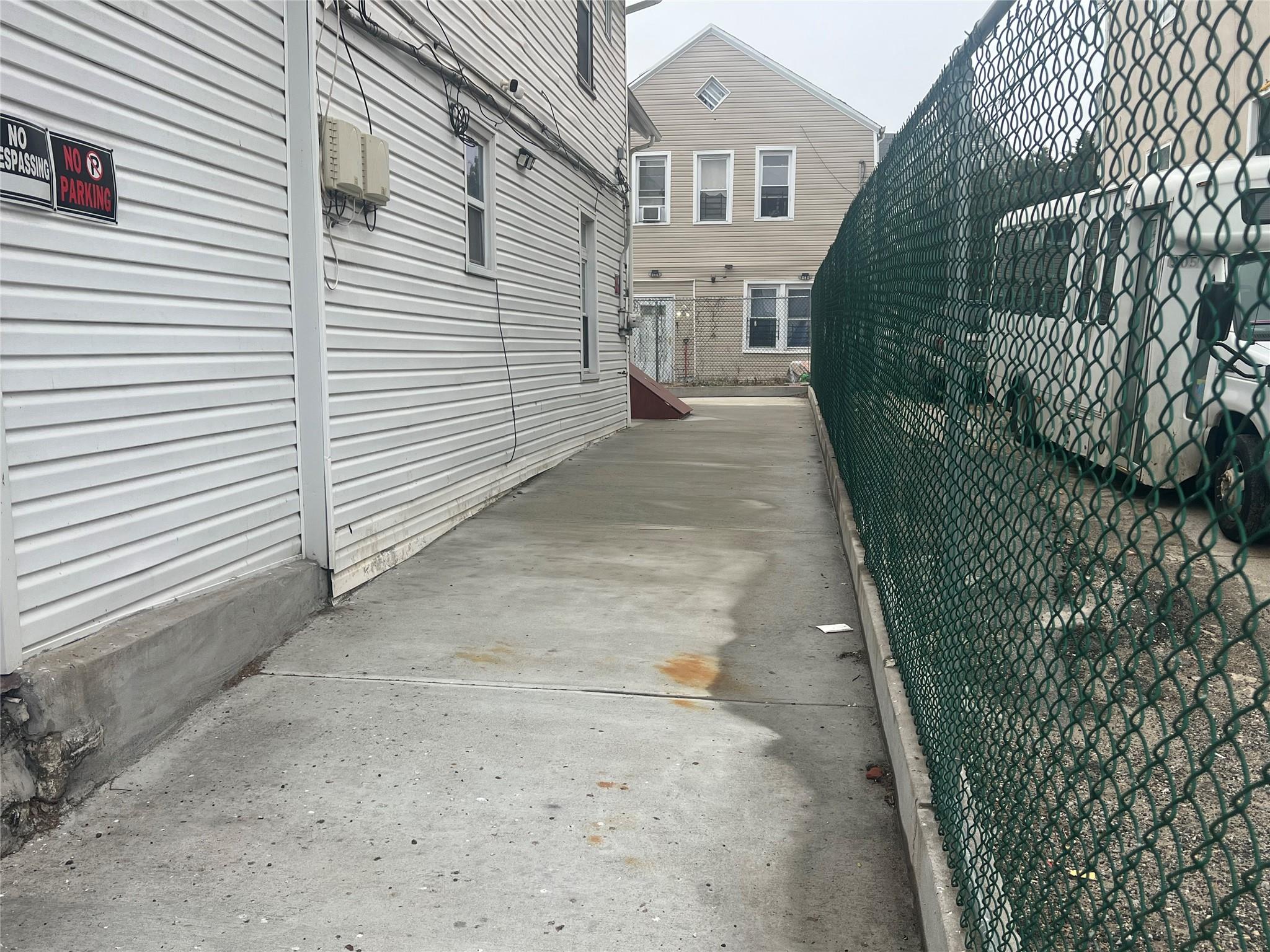 303 Beach 84th Street Queens, NY 11693 - Photo 4 of 16 View of home's exterior with fence