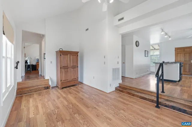 a view of entryway with wooden floor
