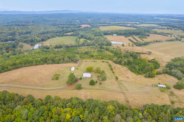 a view of a big yard with green space