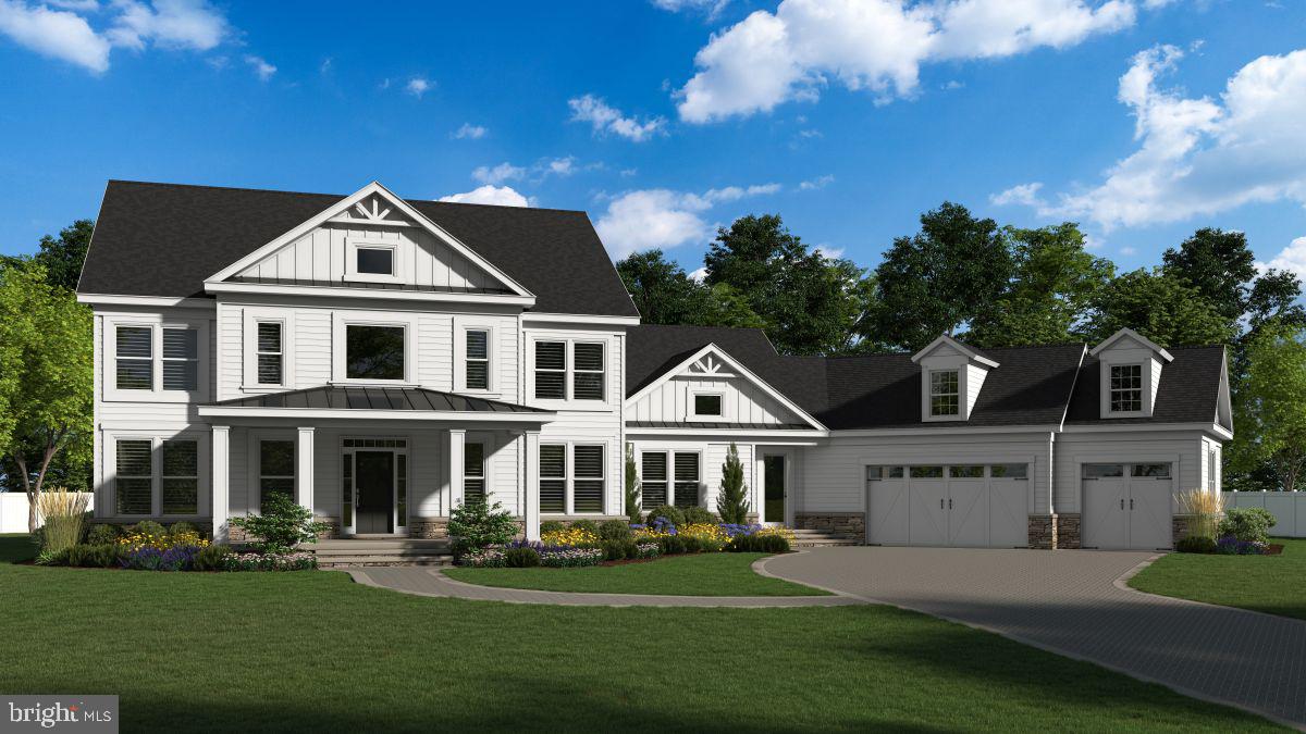 a front view of a house with a garden and pathway