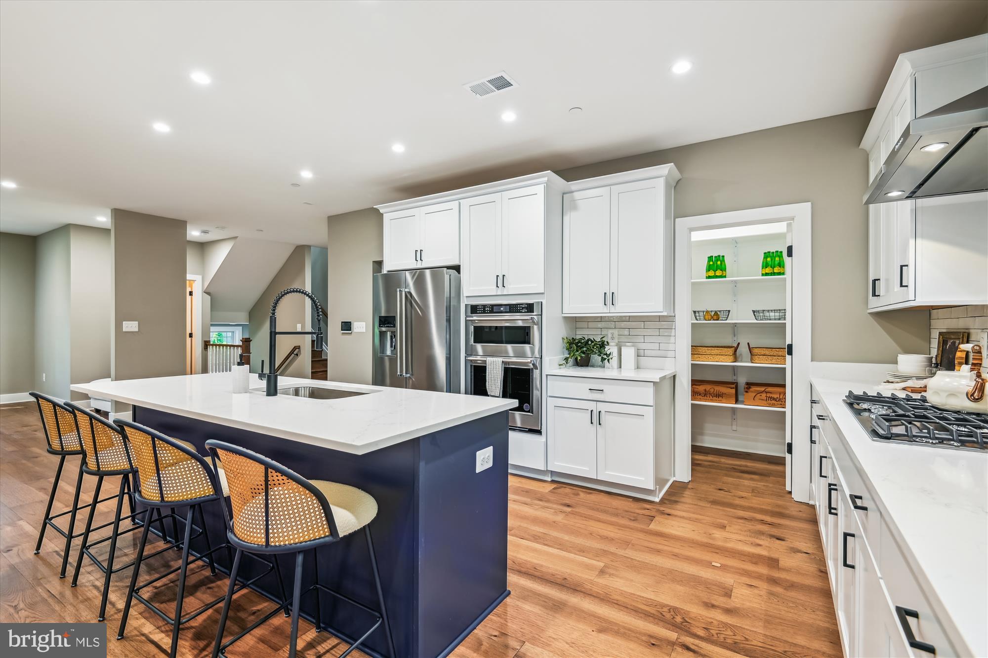 1603 Winchester Road Arnold, MD 21012 - Photo 12 of 39 a kitchen that has a lot of cabinets in it and wooden floors