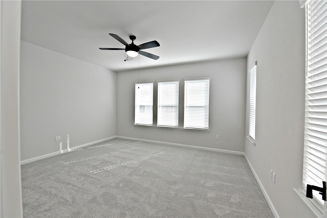 13602 Defiance Pass Austin, TX 78717 - Photo 11 of 19 a view of an empty room with a window