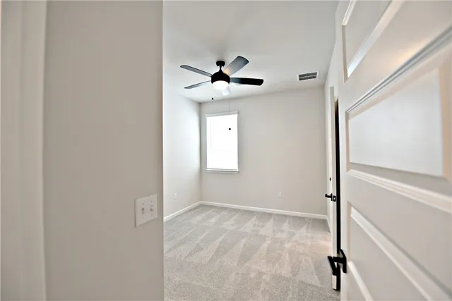 a view of a chandelier fan in a room