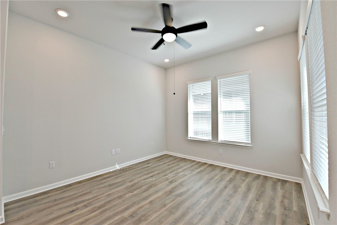 13602 Defiance Pass Austin, TX 78717 - Photo 6 of 19 wooden floor in an empty room with a window