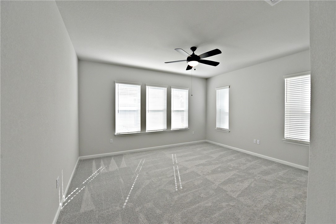 13602 Defiance Pass Austin, TX 78717 - Photo 10 of 19 a view of an empty room with a window