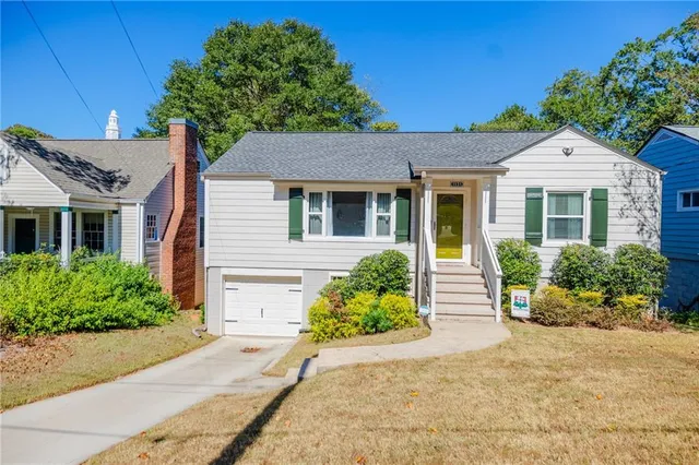 front view of a house with a yard