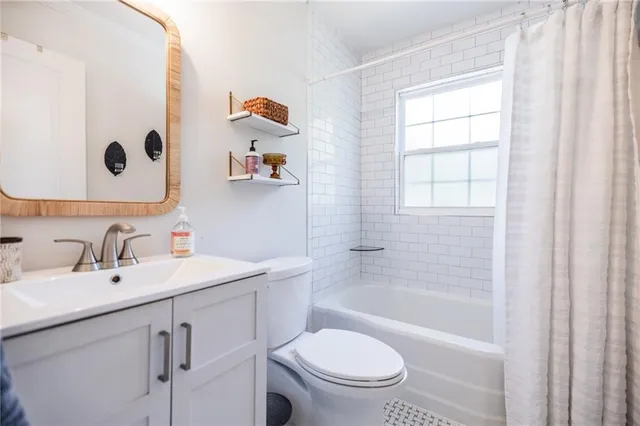 a bathroom with a sink a toilet and a bathtub